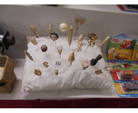 A good collection of antique and vintage hat pins.