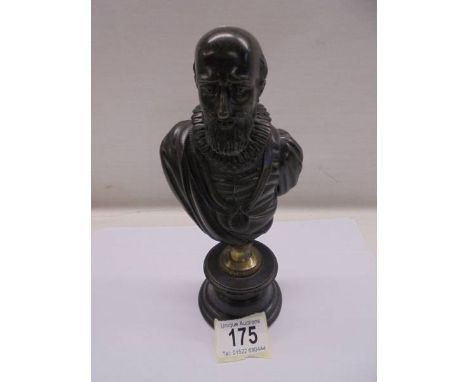 A bronze bust of a male.