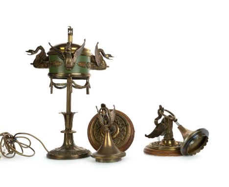VICTORIAN BRASS TABLE LAMP, AND A PAIR OF BRASS WALL HANGING LIGHTS,  with three bird head motifs, above floral swags, on a f