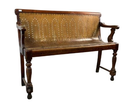 MAHOGANY AND BENTWOOD RAILWAY WAITING ROOM BENCH, LATE 19TH/EARLY 20TH CENTURY  with Gothic pierced tracery to the backrest a