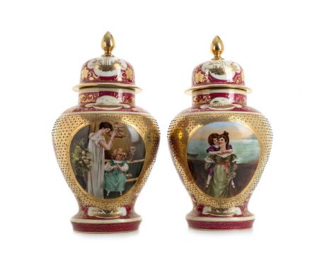 AUSTRIAN VIENNA, PAIR OF JARS AND COVERS,  each of shouldered baluster form, painted with a woman and girl in oval cartouche,