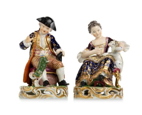 TWO DERBY PORCELAIN FIGURES, EARLY 19TH CENTURY  comprising a seated boy playing with a 'marconi dog', with Derby painted fac