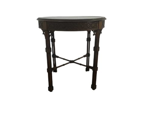 MAHOGANY CIRCULAR OCCASIONAL TABLE, with blind fretted frieze, on triple cluster column legs67cm diameter The top has an agei