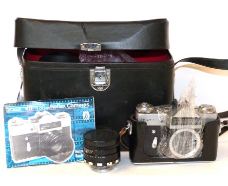 Zenit-E film camera together with a helios-44-2 lens made in the USSR in fitted case