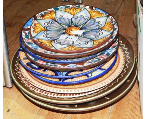 A quantity of studio plates and continental style pottery plates (11) 