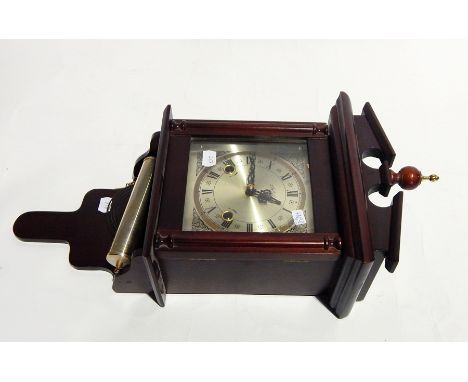 A wall clock, a barometer and clock books 