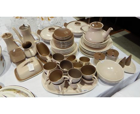 An extensive Poole pottery two-tone dinner service in beige and brown, mainly for eight persons including coffee pot, covered