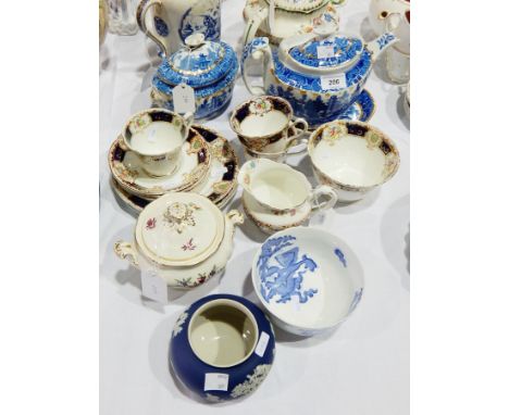 Early 19th century blue and white pottery Willow pattern teapot and stand with gilt highlights, matching covered sucrier and 