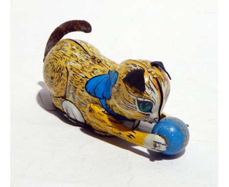 A Tonka tinplate fire engine and a wind-up model of a cat and ball
