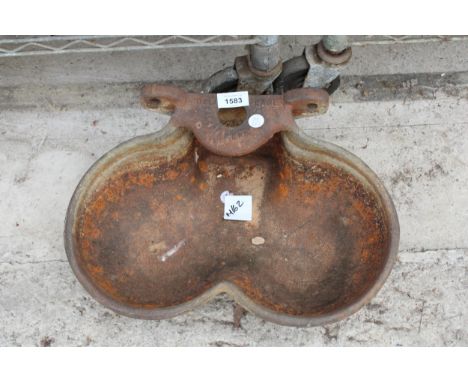 A VINTAGE GALVANISED KIDNEY SHAPED WATER BOWL 
