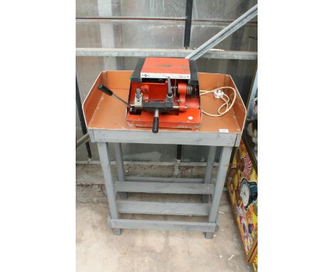 A SILCA REKORD KEY CUTTING AND POLISHING MACHINE ON A WOODEN BENCH BASE, BELIEVED IN WORKING ORDER BUT NO WARRANTY 