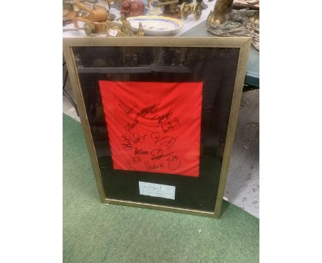 A SIGNED MANCHESTER UNITED FOOTBALL SQUAD PLAYER'S T-SHIRT DATED 10/2/08 WITH CERTIFICATE OF AUTHENTICITY IN A FRAME 