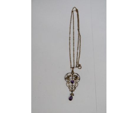 A MARKED 9 CARAT GOLD NECKALCE WITH VINTAGE AMETHYST AND SEED PEARL PENDANT GORSS WEIGHT 5.24 GRAMS IN A PRESENTATION BOX 