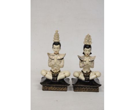 A PAIR OF ORIENTAL HAND PAINTED CERAMIC MALE AND FEMALE TEMPLE DANCERS - 22 CM 