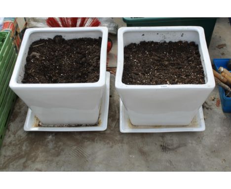 TWO WHITE CERAMIC PLANT POTS WITH TRAYS 