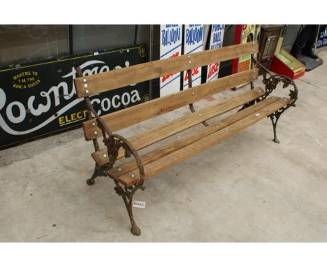 A  WOODEN SLATTED GARDEN BENCH WITH VICTORIAN BLACKBERRY AND VINE CAST BENCH ENDS 
