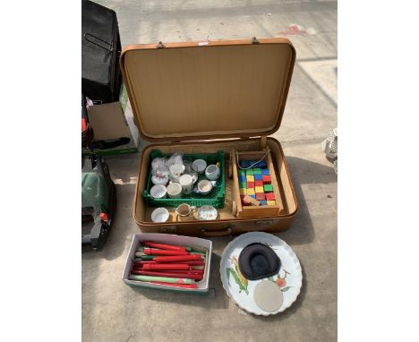 A VINTAGE SUITCASE WITH AN ASSORTMENT OF ITEMS TO INCLUDE CANDLES, A ROYAL WORCESTER DISH AND BUILDING BLOCKS ETC 