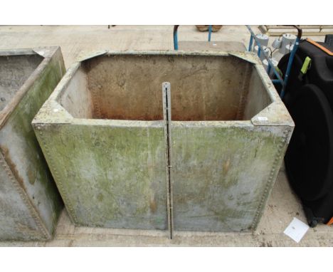 A LARGE VINTAGE GALVANISED RIVETED TROUGH 
