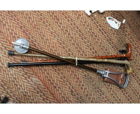 THREE VINTAGE WALKING STICKS PLUS A SHOOTING STICK 