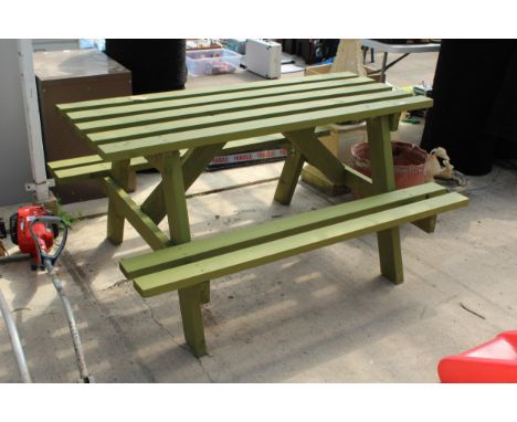A GREEN PAINTED WOODEN SLATTED GARDEN PICNIC BENCH 