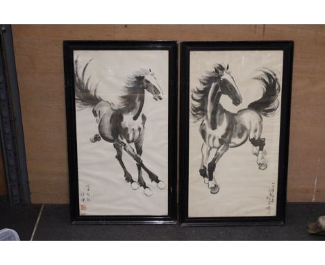 A PAIR OF CHINESE MID CENTURY FRAMED ART BY XU BEIHONG (1895 - 1953) DEPICTING GALLOPING HORSES IN MONOCHROME PEN AND INK SIG