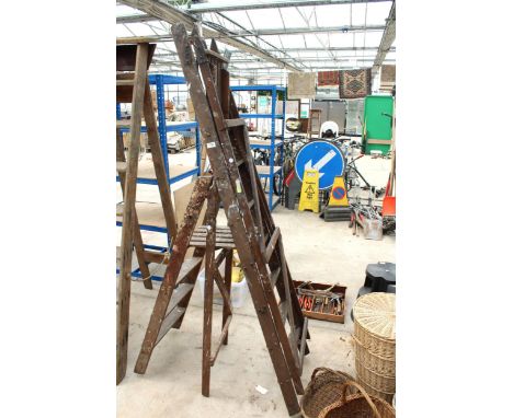 A SIX RUNG VINTAGE WOODEN STEP LADDER AND A FURTHER THREE RUNG WOODEN STEP LADDER 