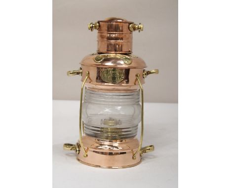 A VINTAGE NAUTICAL BRASS AND COPPER ANCHOR OIL LAMP 