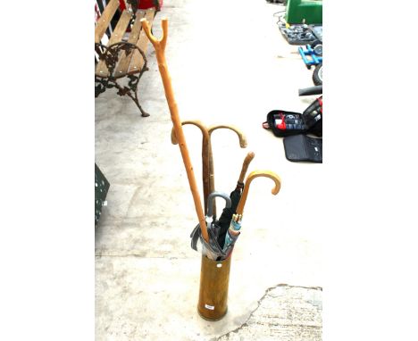 A BRASS TRENCH ART STICK STAND COMPLETE WITH WALKINF STICKS AND UMRELLAS 