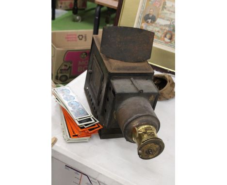 A VICTORIAN MAGIC LANTERN CONSTRUCTED FROM TIN AND BRASS TOGETHER WITH SLIDES 