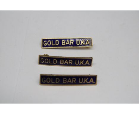 THREE BLUE ENAMEL GOLD BAR U.K.A BADGES FORM THE 1970'S 