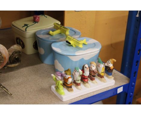 THREE CERAMIC ADVERTISING BUTTER DISHES (UTTERLEY BUTTERLEY AND CLOVER) PLUS A SNOW WHITE AND THE SEVEN DWARVES TOAST RACK 
