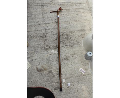 A DECORATIVE WALKING STICK WITH FOX HEAD HANDLE 