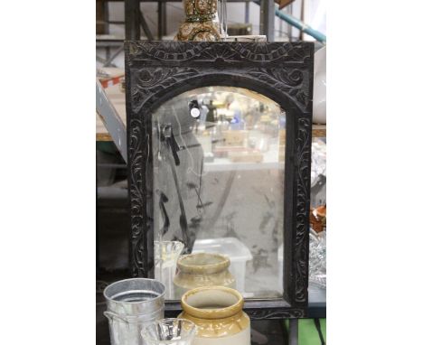 A VINTAGE MIRROR IN A CARVED PANEL FRAME, 40CM X 62CM 