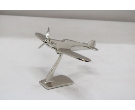 A CHROME MODEL OF A SPITFIRE ON A BASE, HEIGHT 13CM, LENGTH 19CM 