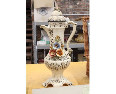 A LARGE VINTAGE CAPODIMONTE JUG WITH LID AND FLORAL PATTERN - A/F 