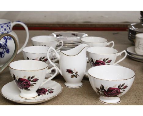 A VINTAGE BONE CHINA FLORAL PATTERNED TEASET TO INCLUDE, A CREAM JUG, SUGAR BOWL, CUPS, SAUCERS AND SIDE PLATES 