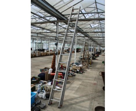 A TWENTY EIGHT RUNG ALUMINIUM EXTENDABLE LADDER 