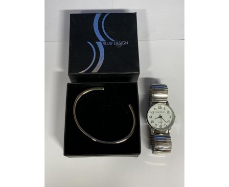 A SUAY DESIGN 'GRAVITY' STEEL BANGLE, TOGETHER WITH A PHILIP MERCIER WATCH 