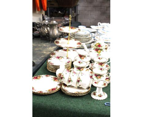 A ROYAL ALBERT "OLD COUNTRY ROSES" TEA SERVICE TO INCLUDE A THREE TIER CAKE STAND, TEA POT, JUG, SUGAR BOWL PLUS CUPS AND SAU
