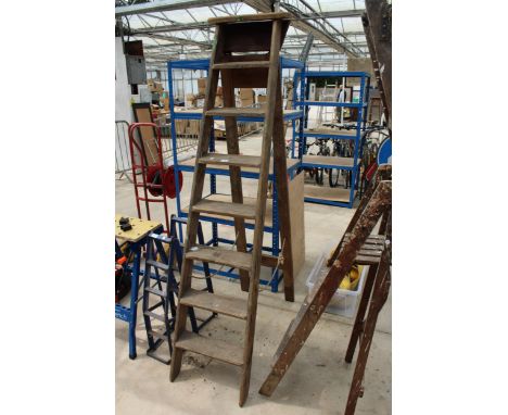 A VINTAGE SEVEN RUNG WOODEN STEP LADDER 