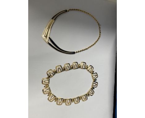 TWO YELLOW METAL CHOKER STYLE NECKLACES, ONE MARKED MONET 