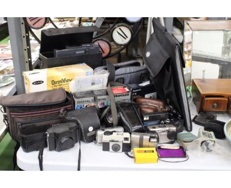 A LARGE COLLECTION OF CAMERAS AND ACCESSORIES TO INCLUDE MAINLY KODAK, PLUS BAGS,2 PORT KVM SWITCH, A ROLLEI PROJECTOR, LENS,