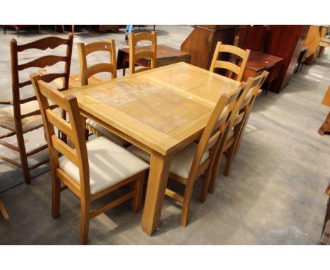 AN OAK EXTENDING DINING TABLE, 59" X 35.5" (LEAF 15.5") AND SIX LADDER BACK DINING CHAIRS 
