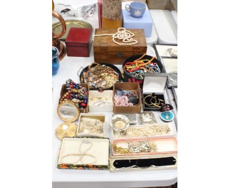 A LARGE QUANTITY OF COSTUME JEWELLERY TO INCLUDE PEARLS, NECKLACES, BROOCHES, EARRINGS, BEADS, ETC, PLUS TWO BOXES, A VINTAGE