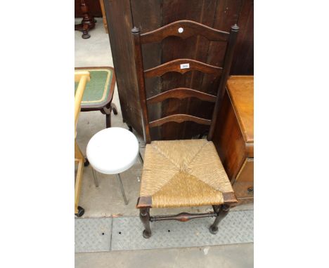 AN OAK LADDER-BACK RUSH SEATED COUNTRY CHAIR AND LOW STOOL ON CHROME LEGS 