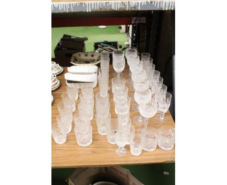A LARGE QUANTITY OF LEAD CRYSTAL GLASSES TO INCLUDE CHAMPAGNE FLUTES, WINE, TUMBLERS, ETC PLUS ROYAL WORCESTER AND PORTMEIRIO