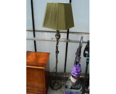 A DECORATIVE METAL STANDARD LAMP WITH SHADE 