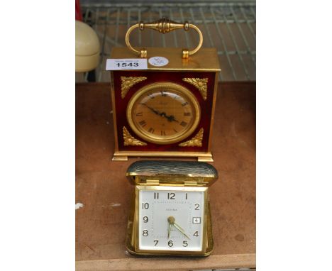 A 15 JEWELS SWISS MANTLE CLOCK AND A FURTHER FOLDING CASED ESTYMA CLOCK 