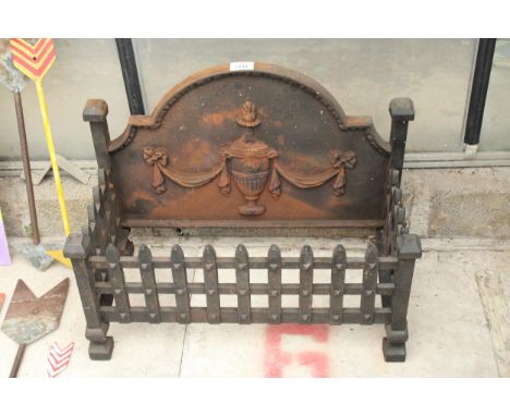 A DECORATIVE CAST IRON FIRE GRATE WITH CAST PLAQUE BACK 