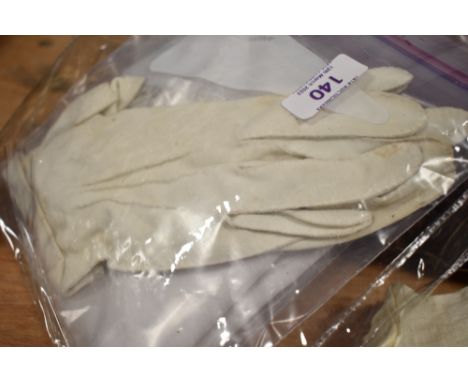 A vintage cotton Flour bag with print, a pair of cotton gloves and a silk scarf.